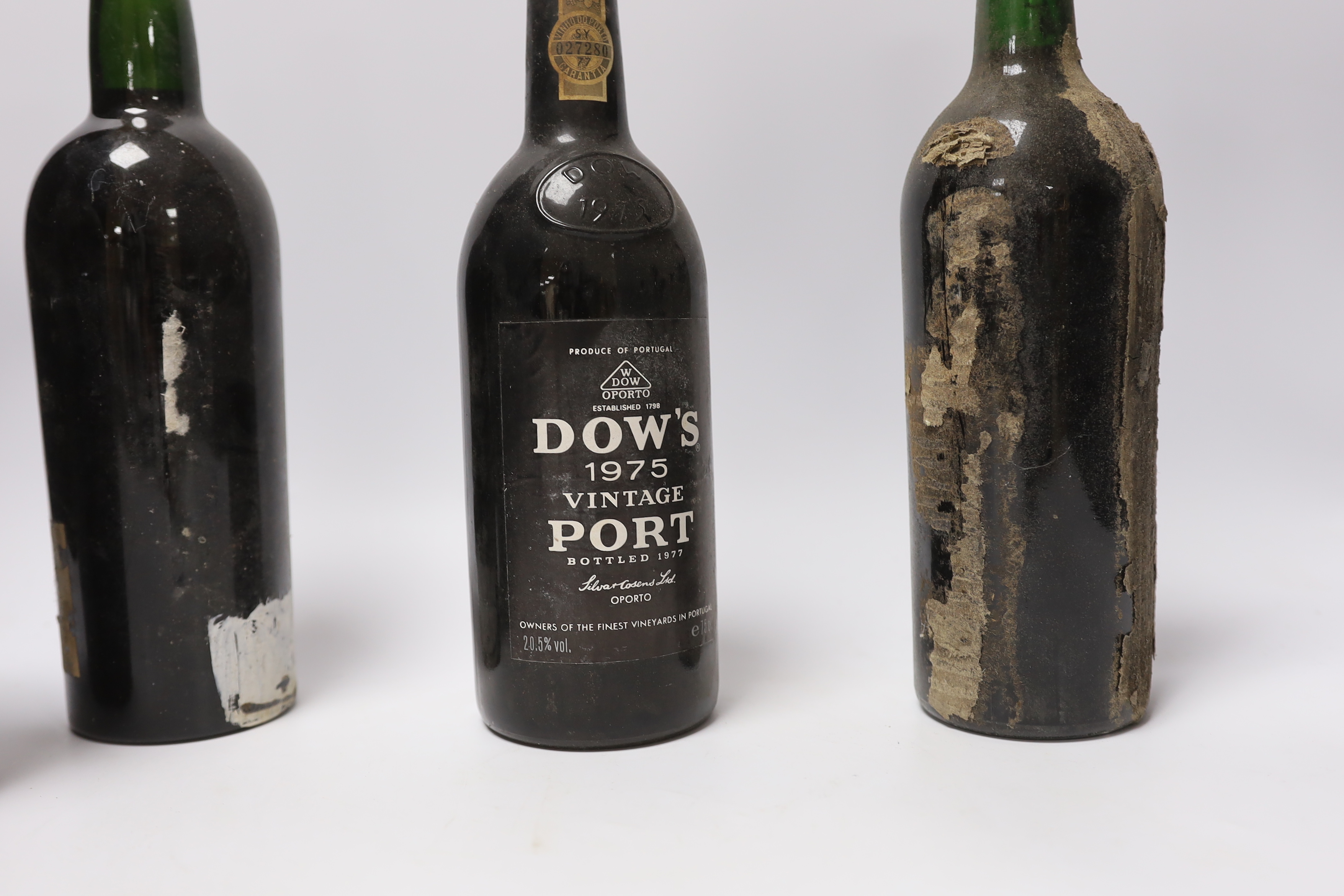 Thirteen various bottles of port, including a bottle of Dow’s 1975 vintage port